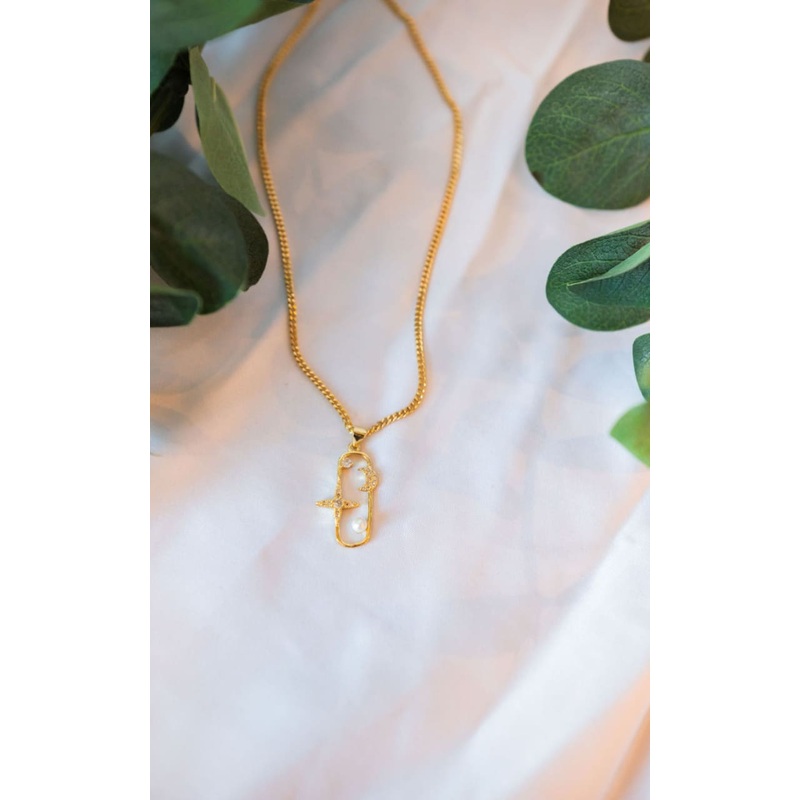 Twisted Baubles – Star, Moon & Pearl Necklace